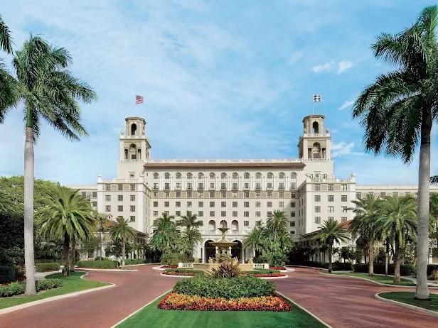 The Breakers hotel in Palm Beach seen from its palm-lined entrance drive