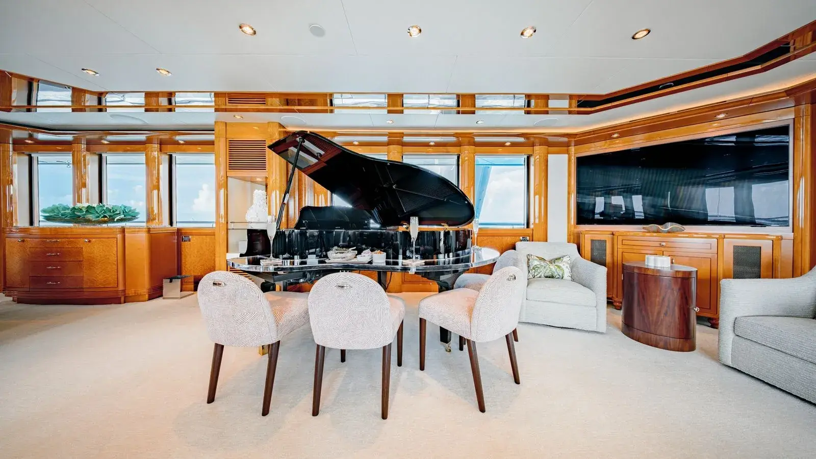 AS YOU WISH — the main salon: the grand piano and the dining table in cherry and cream