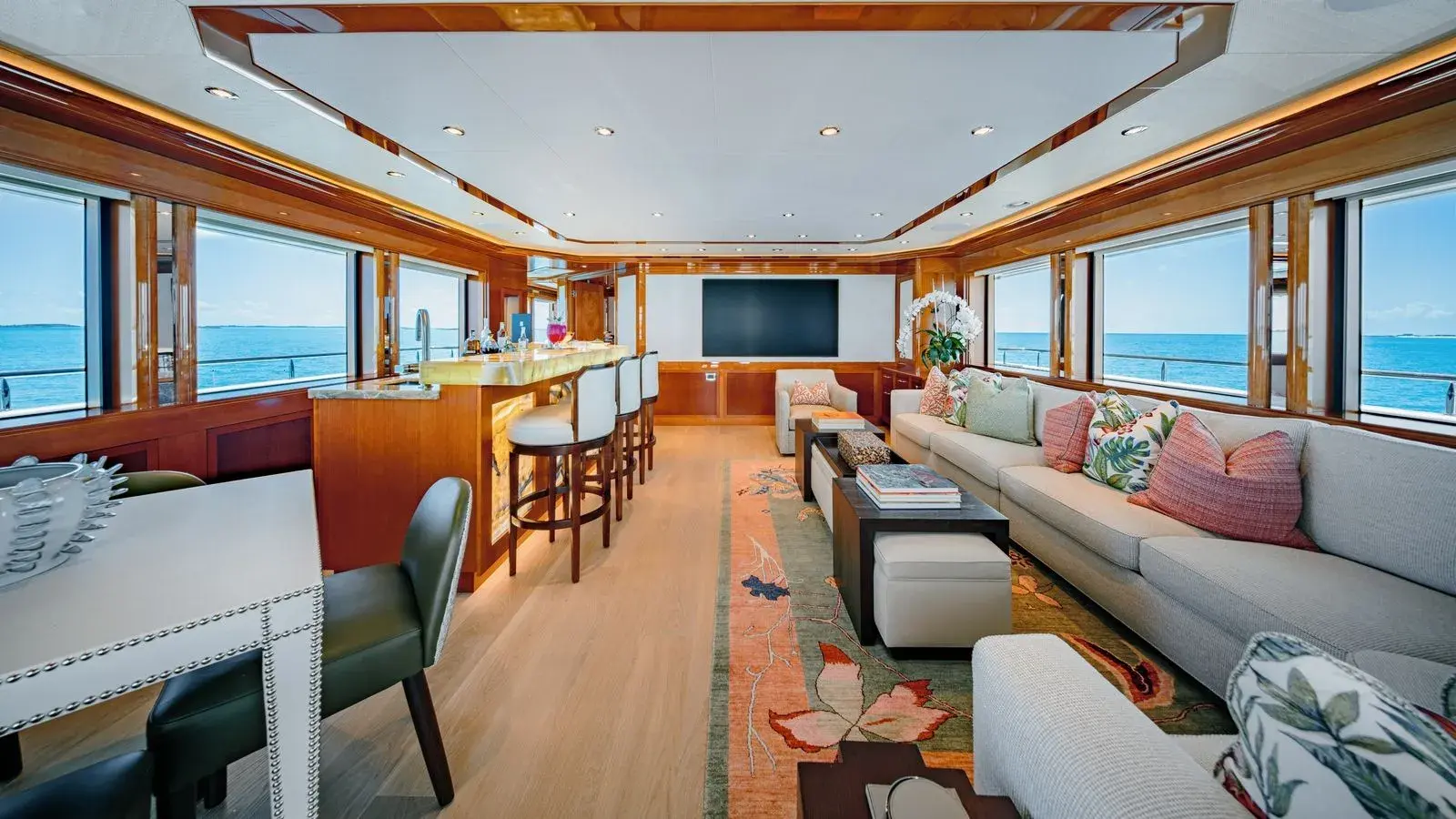 AS YOU WISH — the skylounge, screen and sofas, the sea in every window