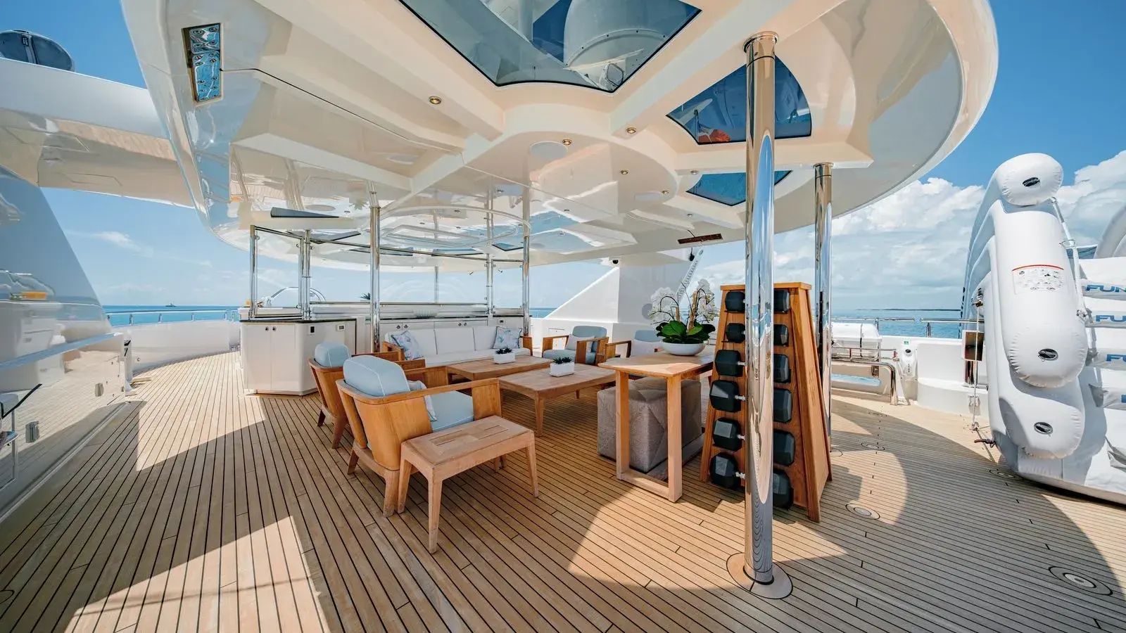 AS YOU WISH — the sundeck bar under the hardtop, teak underfoot